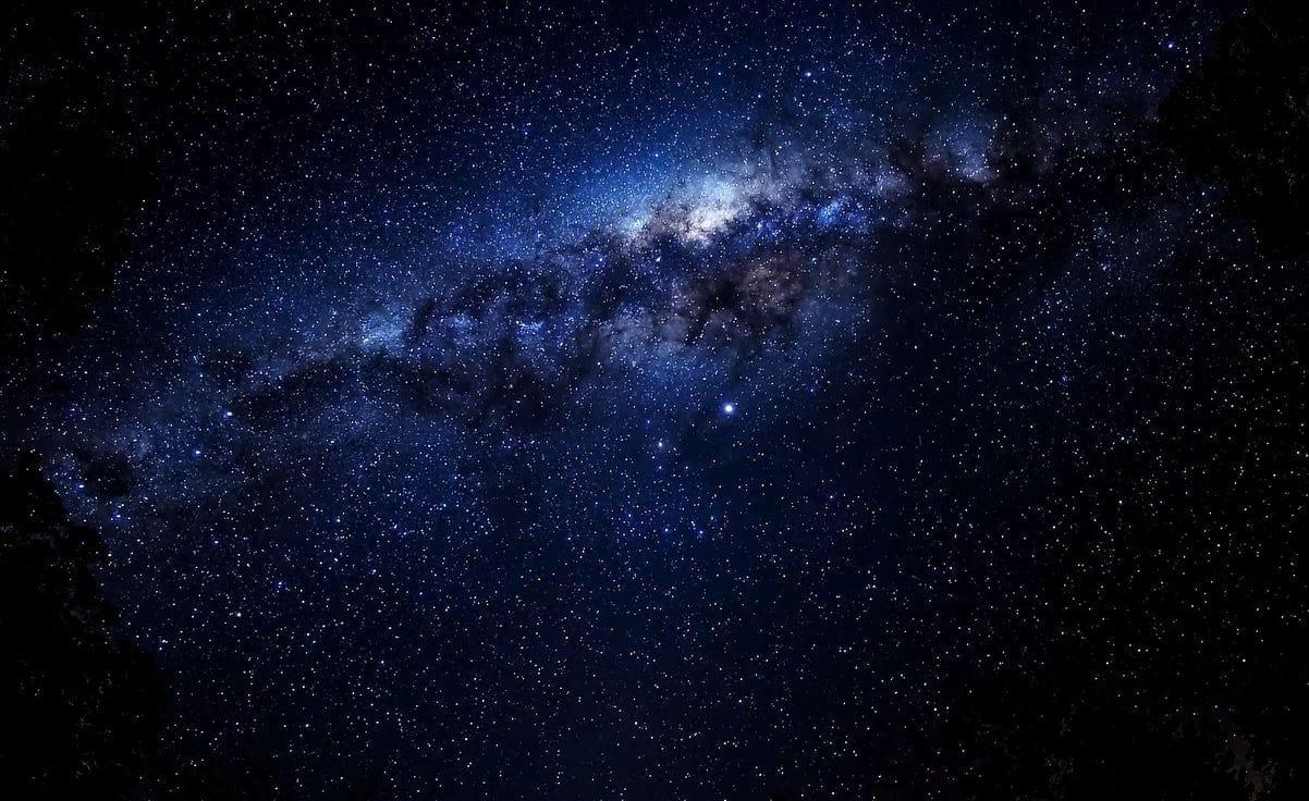 A vibrant, colorful galaxy in deep space, serving as a background.